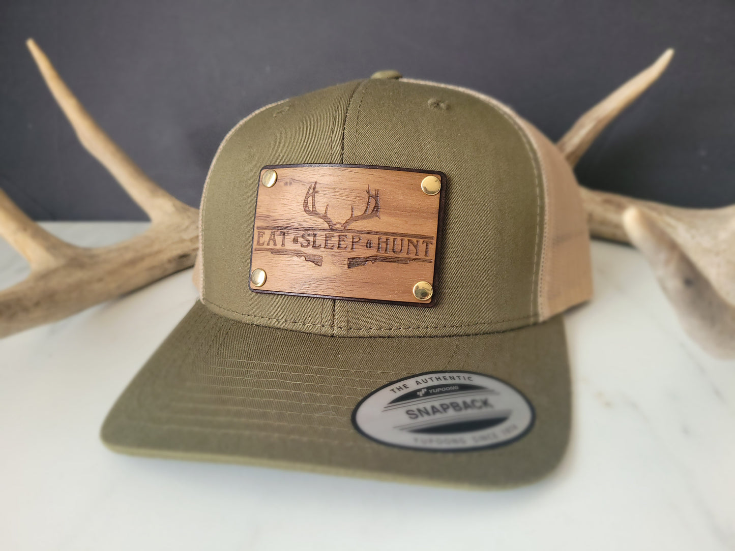 Eat Sleep Hunt premium walnut and leather patch trucker hat
