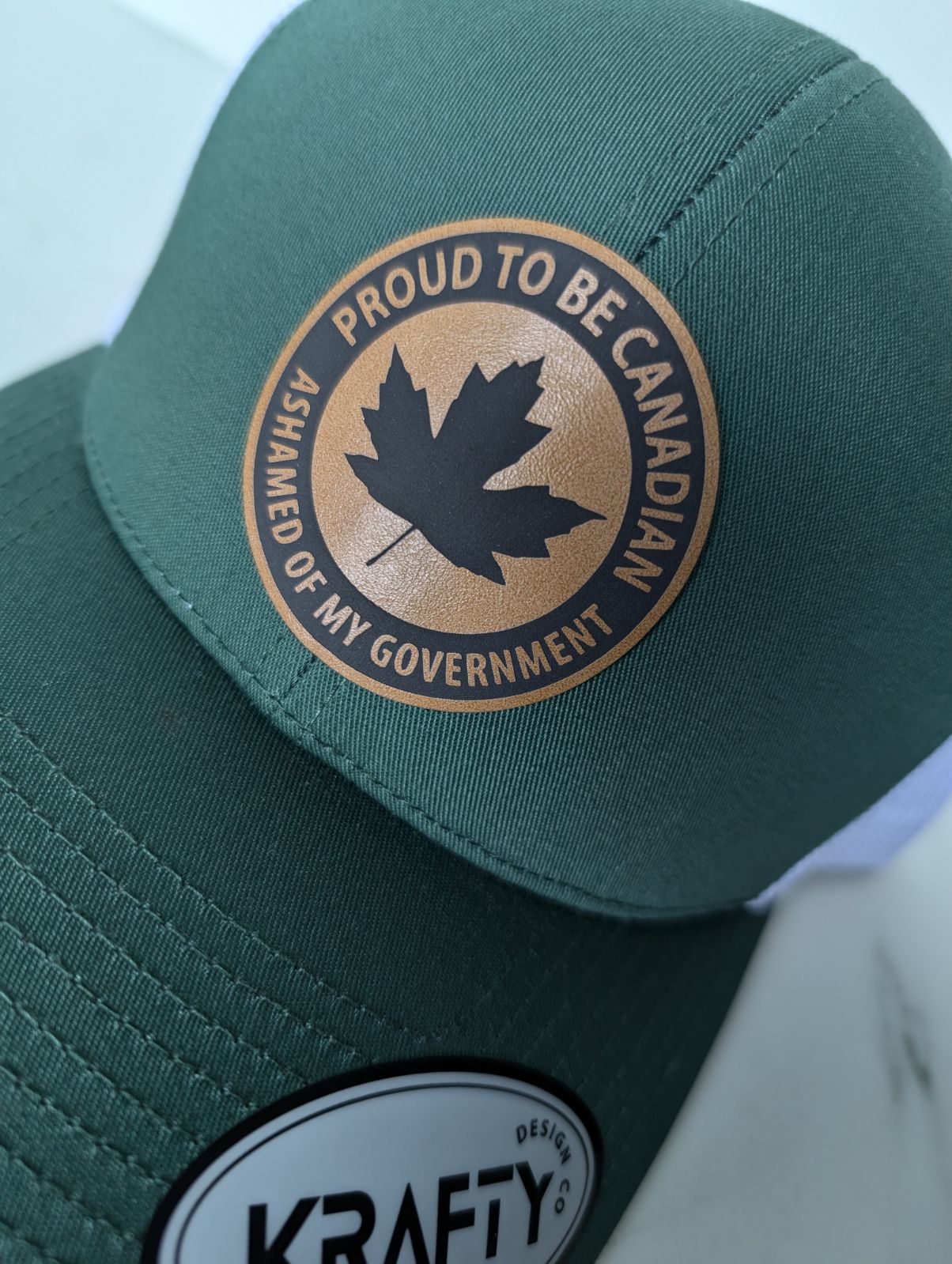 PROUD TO BE CANADIAN ASHAMED OF MY GOVERNMENT leather style patch trucker hat