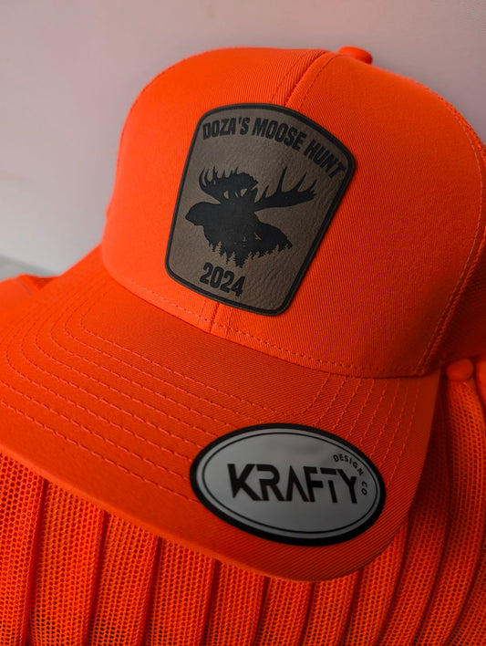Blaze orange trucker hat featuring moose hunting patch