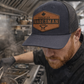 Person wearing a 'Canadian Tradesman' cap in a kitchen setting