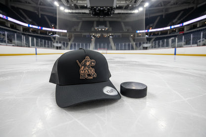 a black trucker hat featuring a rawhide patch featuring a hockey goalie and custom name MATT across the design