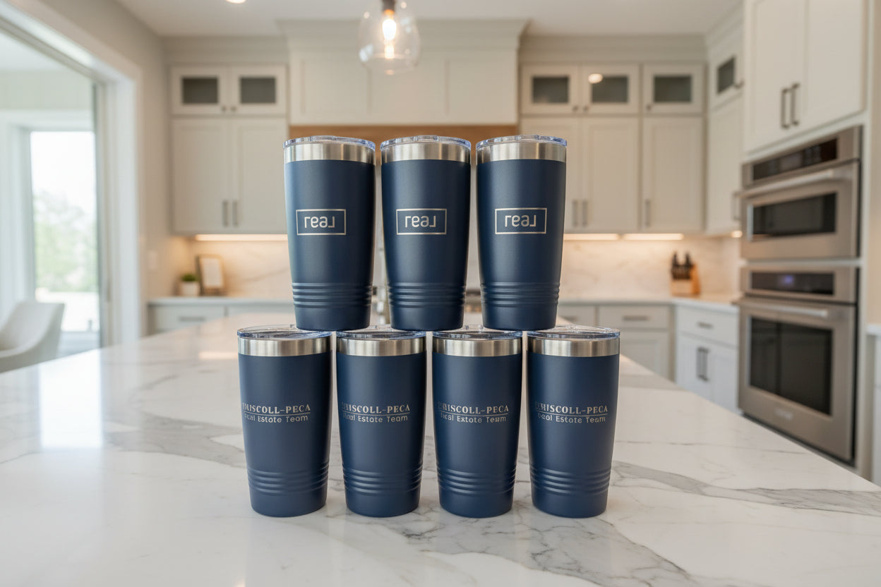 Set of blue tumblers with silver lids on a white background