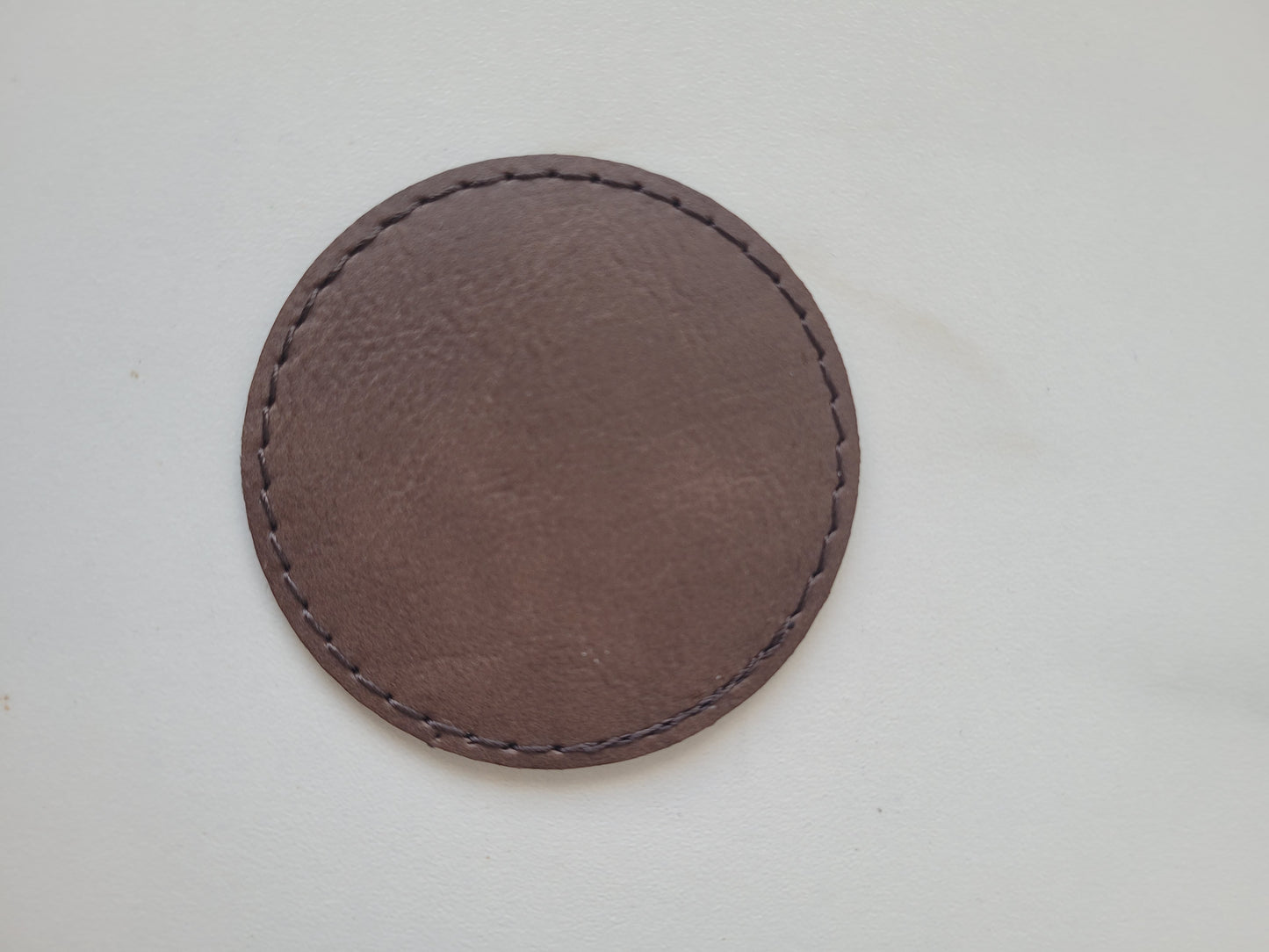 Engraved dark brown patch